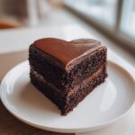 black heart shaped birthday cake