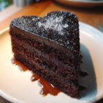 black heart shaped cake with glitter